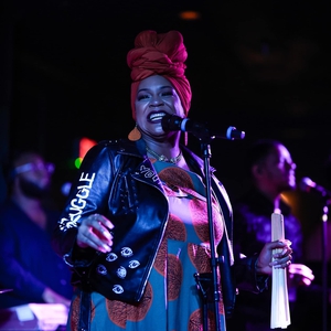 Erykah Badu performing live on stage during 2025 tour